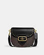 COACH®,MORGAN SADDLE BAG IN COLORBLOCK SIGNATURE CANVAS WITH RIVETS,Medium,Gold/Brown Black Multi,Front View