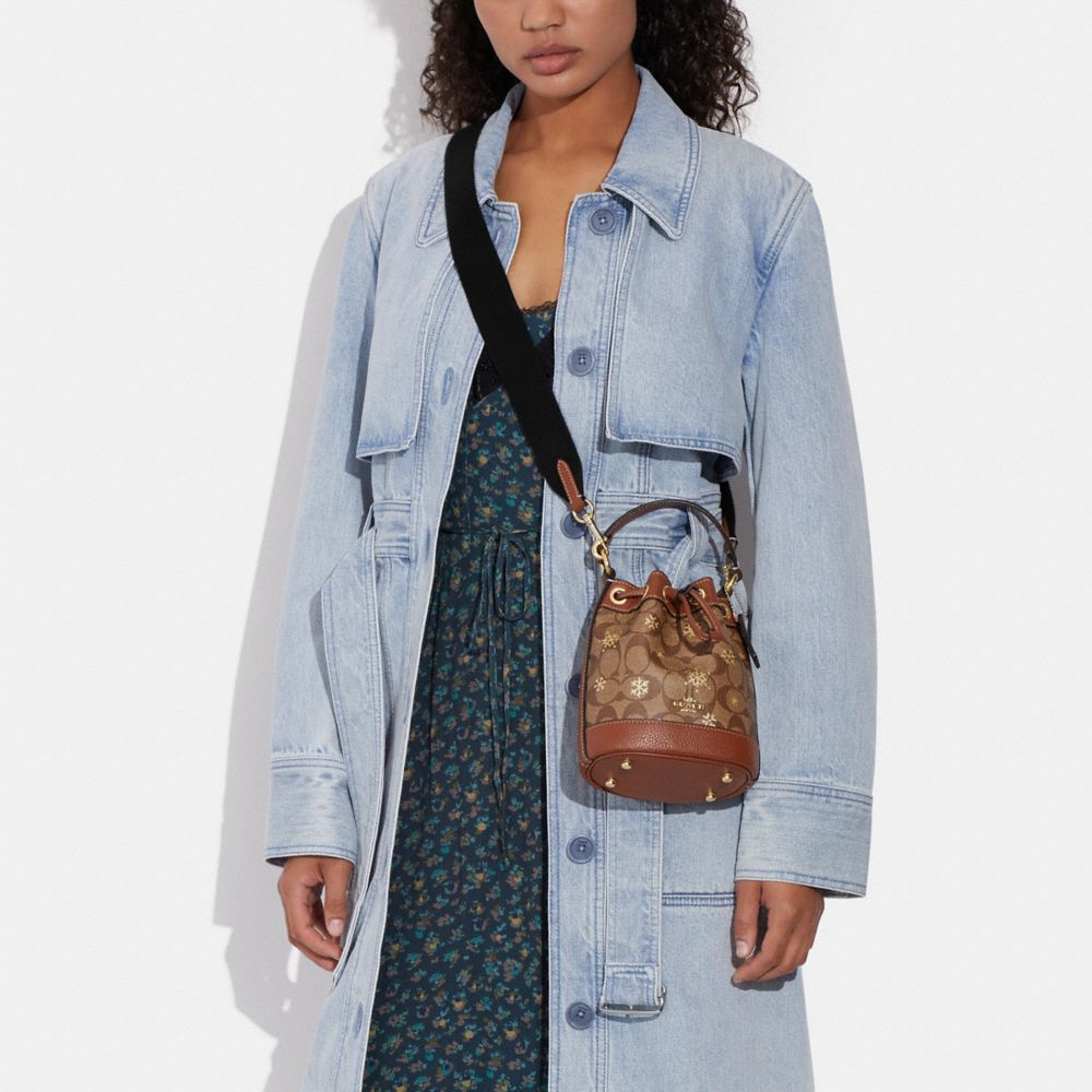 COACH Dempsey Drawstring Bucket Bag In Signature Denim in Blue