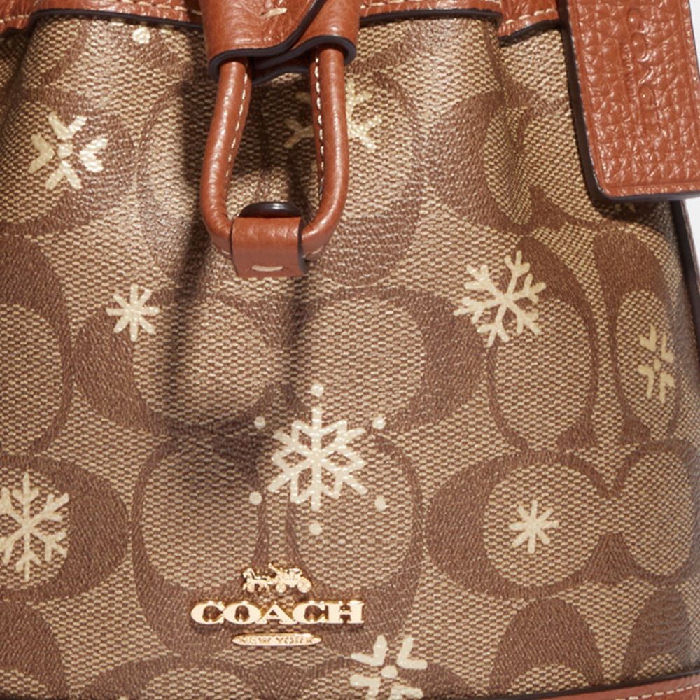 COACH Dempsey 15 Small Snowflake Print Khaki Coated Canvas Bucket Bag