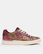 COACH®,CLIP LOW TOP SNEAKER IN SIGNATURE CANVAS WITH FLORAL PRINT,Signature Coated Canvas,Khaki/ Black Cherry,Angle View