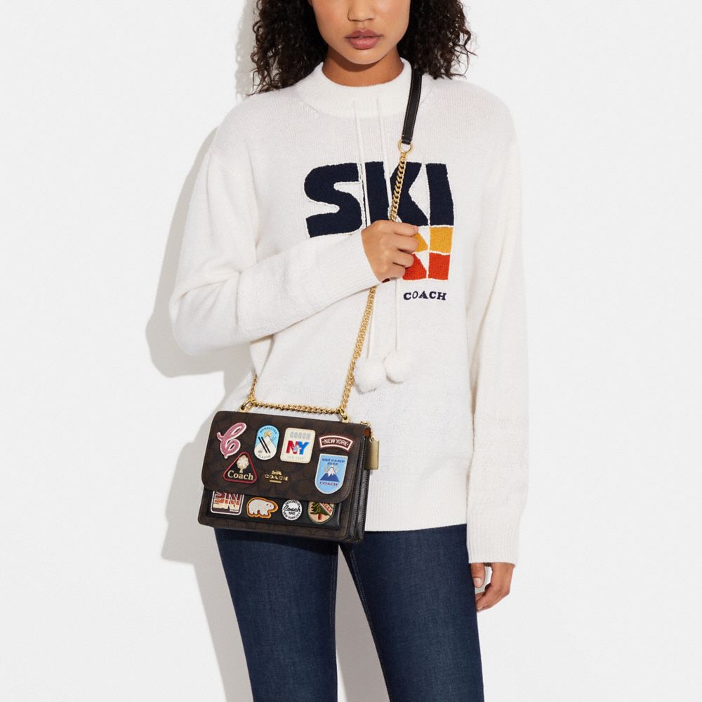 COACH®,Klare Crossbody Bag In Signature Canvas With Ski Patches,,Detail View