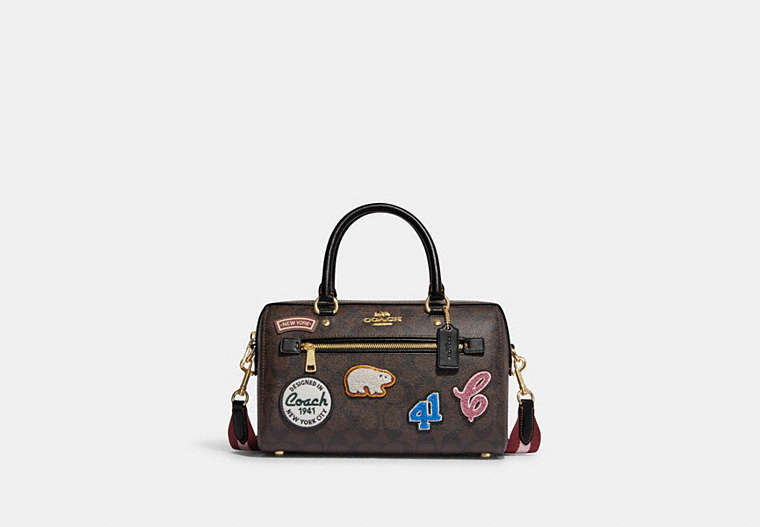COACH®,ROWAN SATCHEL BAG IN SIGNATURE CANVAS WITH SKI PATCHES,Medium,Gold/Brown Black Multi,Front View