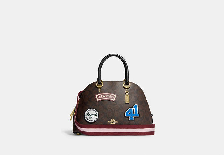COACH®,KATY SATCHEL IN SIGNATURE CANVAS WITH SKI PATCHES,Medium,Gold/Brown Black Multi,Front View