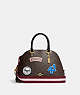 COACH®,KATY SATCHEL IN SIGNATURE CANVAS WITH SKI PATCHES,Medium,Gold/Brown Black Multi,Front View
