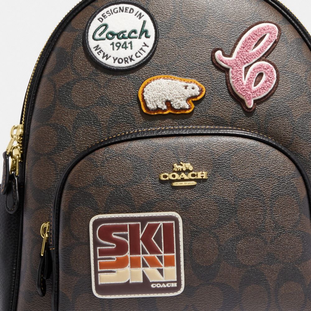 Coach Outlet Disney X Coach Court Backpack In Signature Canvas With Patches