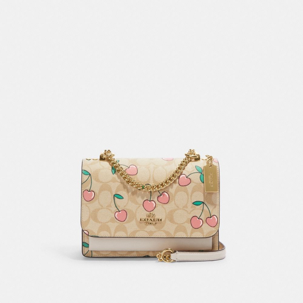 white / cream with pink cherry hearts coach purse