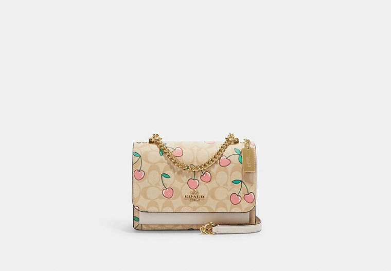 COACH®,KLARE CROSSBODY IN SIGNATURE CANVAS WITH HEART CHERRY PRINT,Fabric,Gold/Light Khaki Multi,Front View