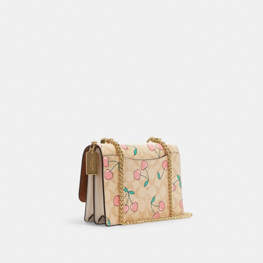 COACH®,KLARE CROSSBODY IN SIGNATURE CANVAS WITH HEART CHERRY PRINT,Fabric,Medium,Gold/Light Khaki Multi,Angle View