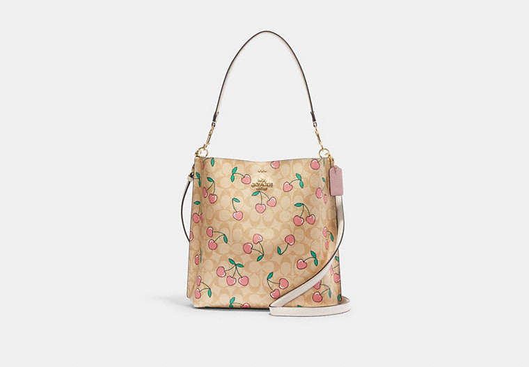 COACH®,MOLLIE BUCKET BAG IN SIGNATURE CANVAS WITH HEART CHERRY PRINT,Fabric,Gold/Light Khaki Multi,Front View