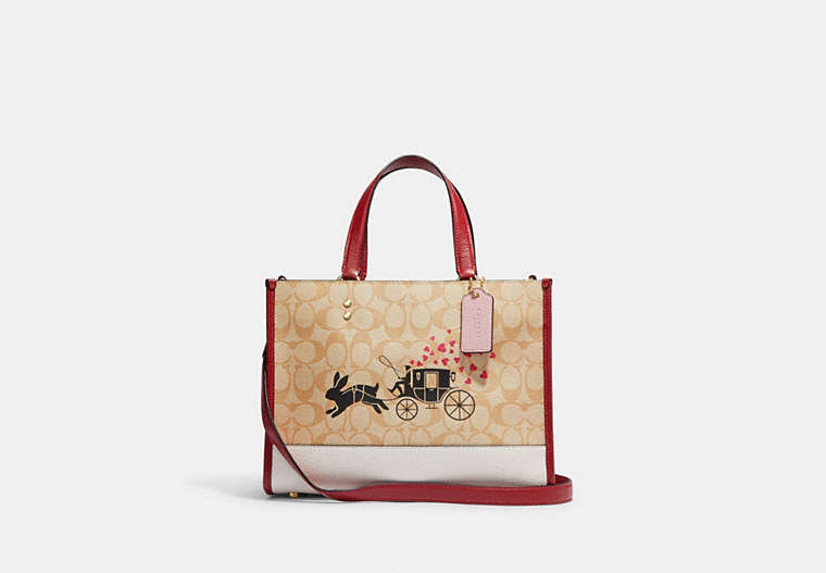 COACH®,LUNAR NEW YEAR DEMPSEY CARRYALL IN SIGNATURE CANVAS WITH RABBIT AND CARRIAGE,Medium,Gold/Light Khaki Multi,Front View