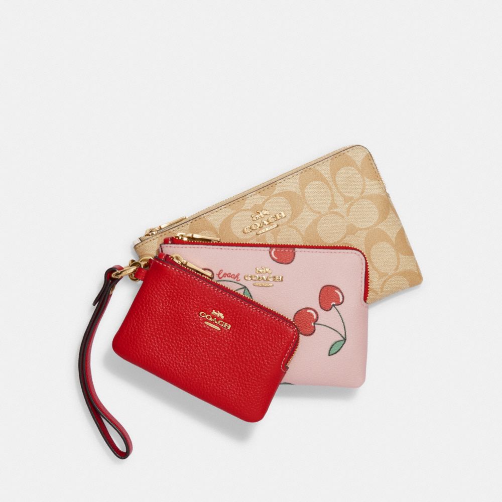 COACH®  Corner Zip Wristlet In Signature Canvas With Heart Cherry