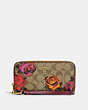 COACH®,LONG ZIP AROUND WALLET IN SIGNATURE CANVAS WITH JUMBO FLORAL PRINT,Mini,Gold/Khaki Multi,Front View