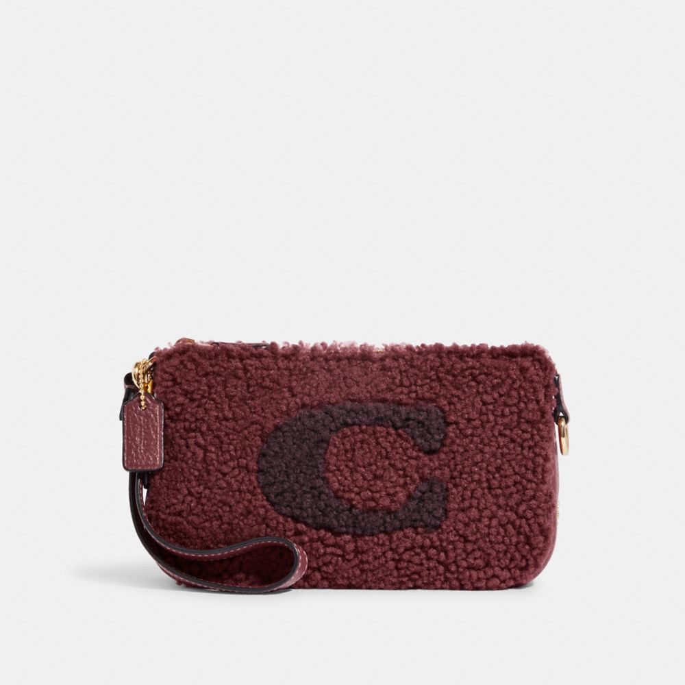 COACH Nolita Wristlet 19 In Prairie Print Coated Canvas With Rebel Charm