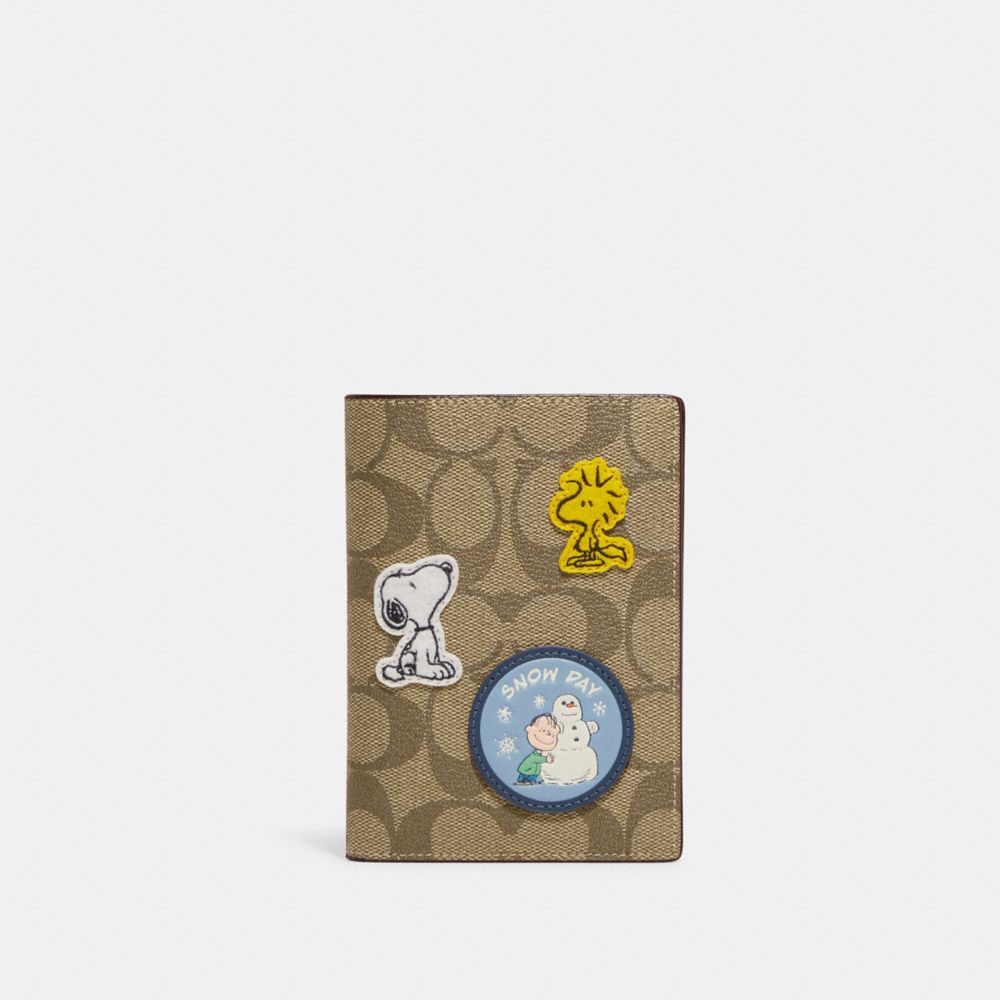 COACH® | Coach X Peanuts Passport Case In Signature Canvas With