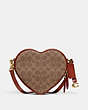 COACH®,HEART CROSSBODY BAG IN SIGNATURE CANVAS,Signature Coated Canvas,Small,Brass/Tan/Rust,Front View