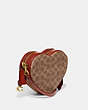 COACH®,HEART CROSSBODY IN SIGNATURE CANVAS,Signature Coated Canvas,Small,Brass/Tan/Rust,Angle View