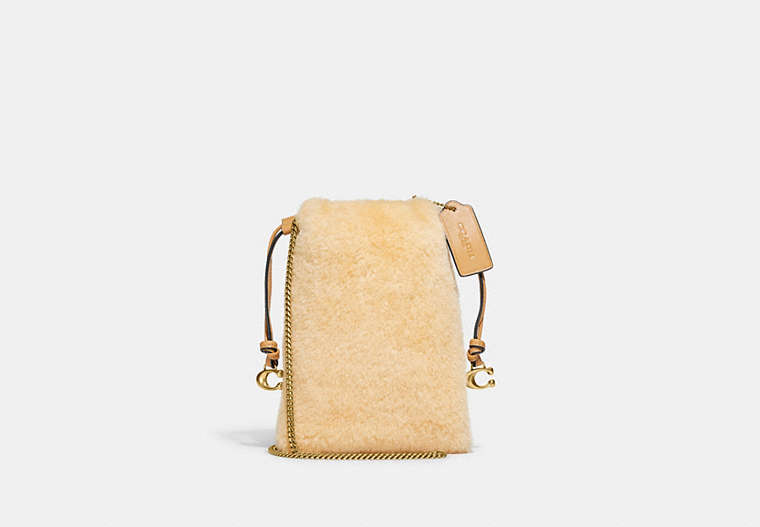 COACH®,DRAWSTRING POUCH IN SHEARLING,Shearling,Mini,Brass/Natural,Front View