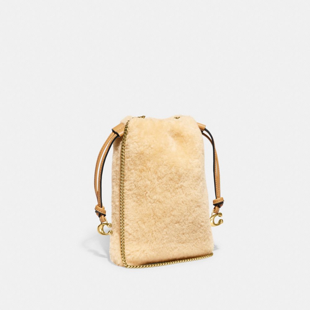 COACH®,POCHETTE À LIEN COULISSANT EN RASON,Laiton/Naturel,Angle View
