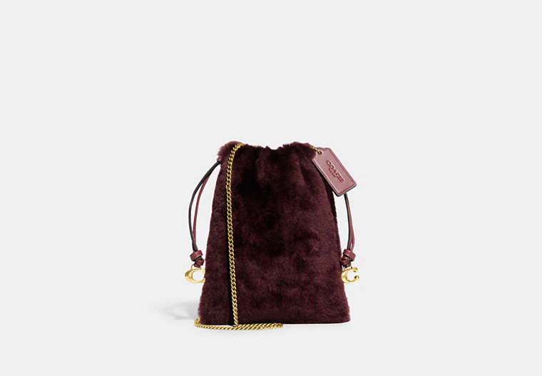 COACH®,DRAWSTRING POUCH IN SHEARLING,Shearling,Mini,Brass/Sangria,Front View