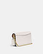 COACH®,TABBY CHAIN CLUTCH,Polished Pebble Leather,Brass/Chalk,Angle View