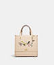 COACH®,COACH X PEANUTS DEMPSEY TOTE 22 WITH SNOOPY AND FRIENDS MOTIF,Refined Pebble Leather,Medium,Gold/Ivory Multi,Front View