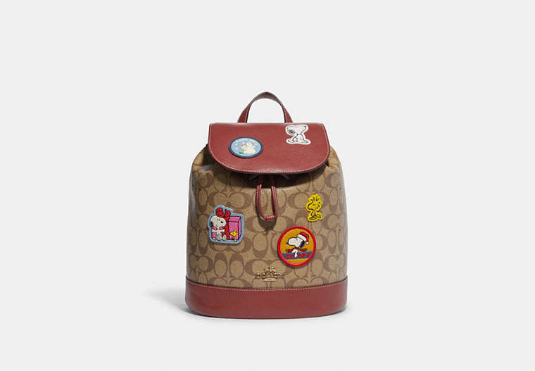 COACH®,COACH X PEANUTS DEMPSEY DRAWSTRING BACKPACK IN SIGNATURE CANVAS WITH PATCHES,Signature Coated Canvas,Large,Gold/Khaki/Redwood Multi,Front View