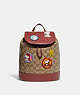 COACH®,COACH X PEANUTS DEMPSEY DRAWSTRING BACKPACK IN SIGNATURE CANVAS WITH PATCHES,Signature Coated Canvas,Large,Gold/Khaki/Redwood Multi,Front View