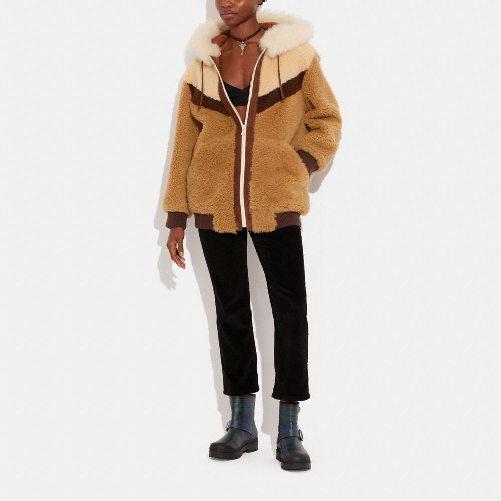 COACH®: Reversible Shearling Hoodie