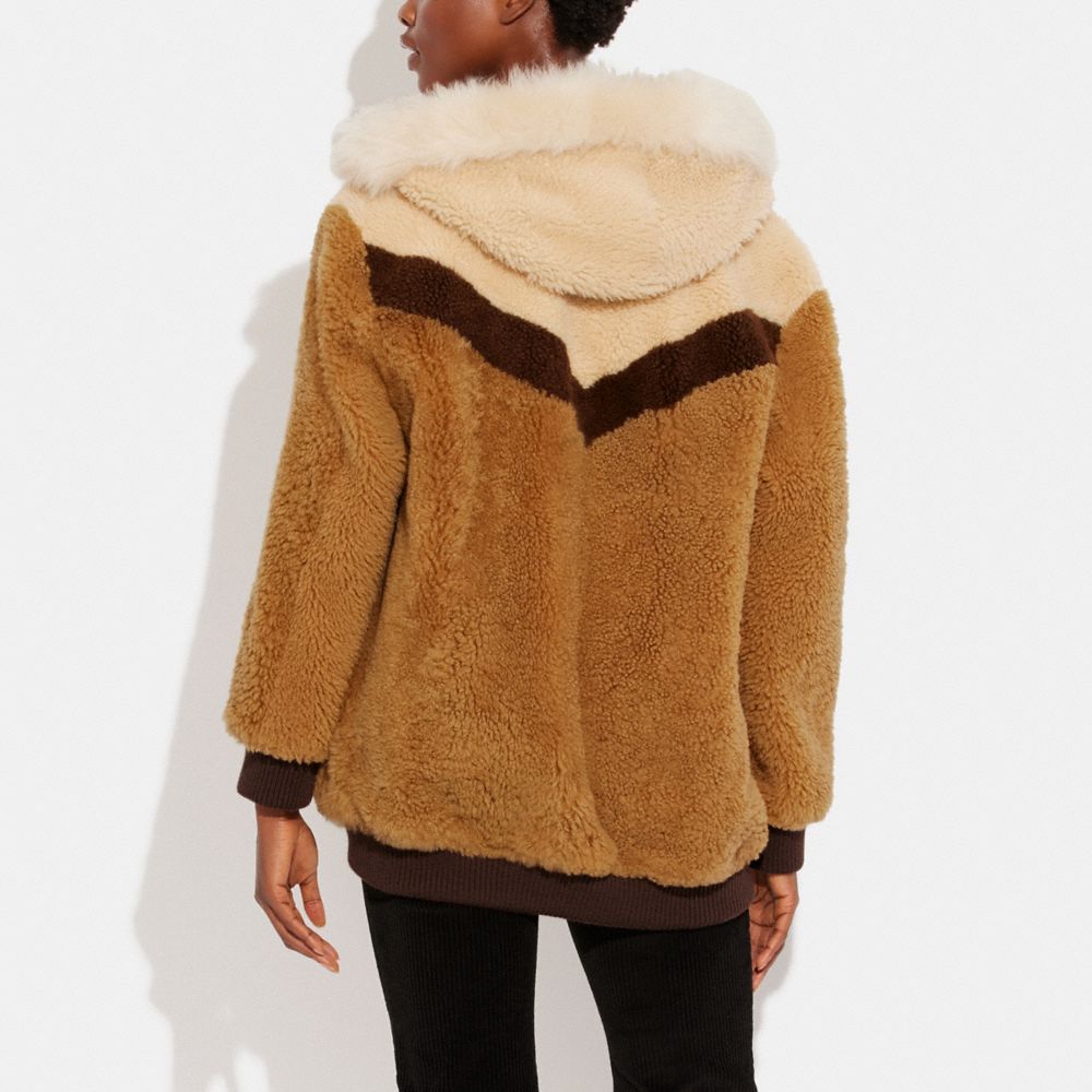 COACH®: Reversible Shearling Hoodie