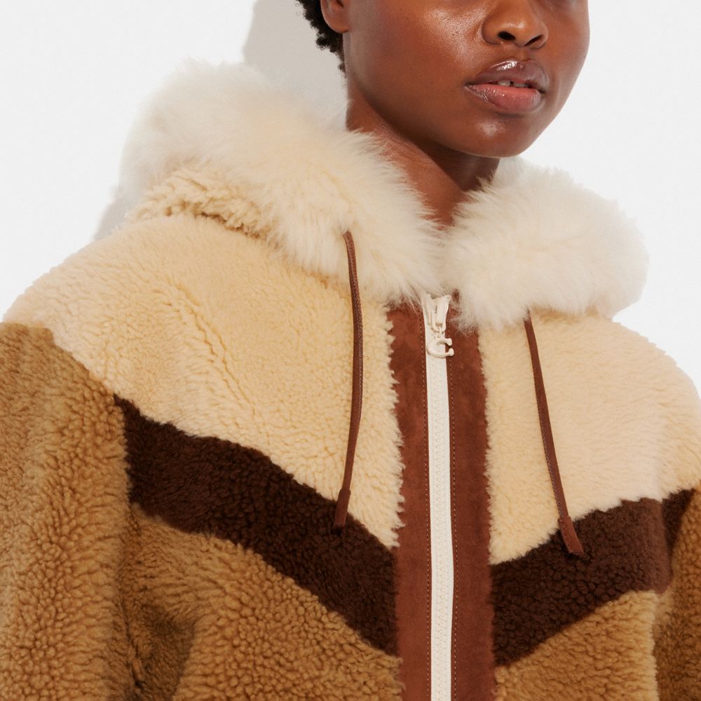 COACH®: Reversible Shearling Hoodie