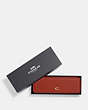COACH®,BOXED DOMINO SET,Mini,Brass/Red Sand,Front View