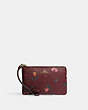 COACH®,CORNER ZIP WRISTLET WITH HOLIDAY BELLS PRINT,Printed Coated Canvas,Mini,Gold/Black Cherry Multi,Front View