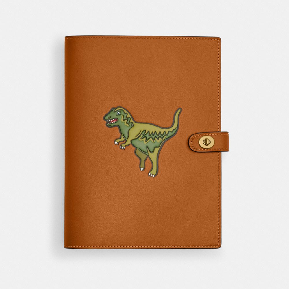 COACH®,NOTEBOOK WITH REXY,Glovetanned Leather,Brass/Hazelnut,Front View