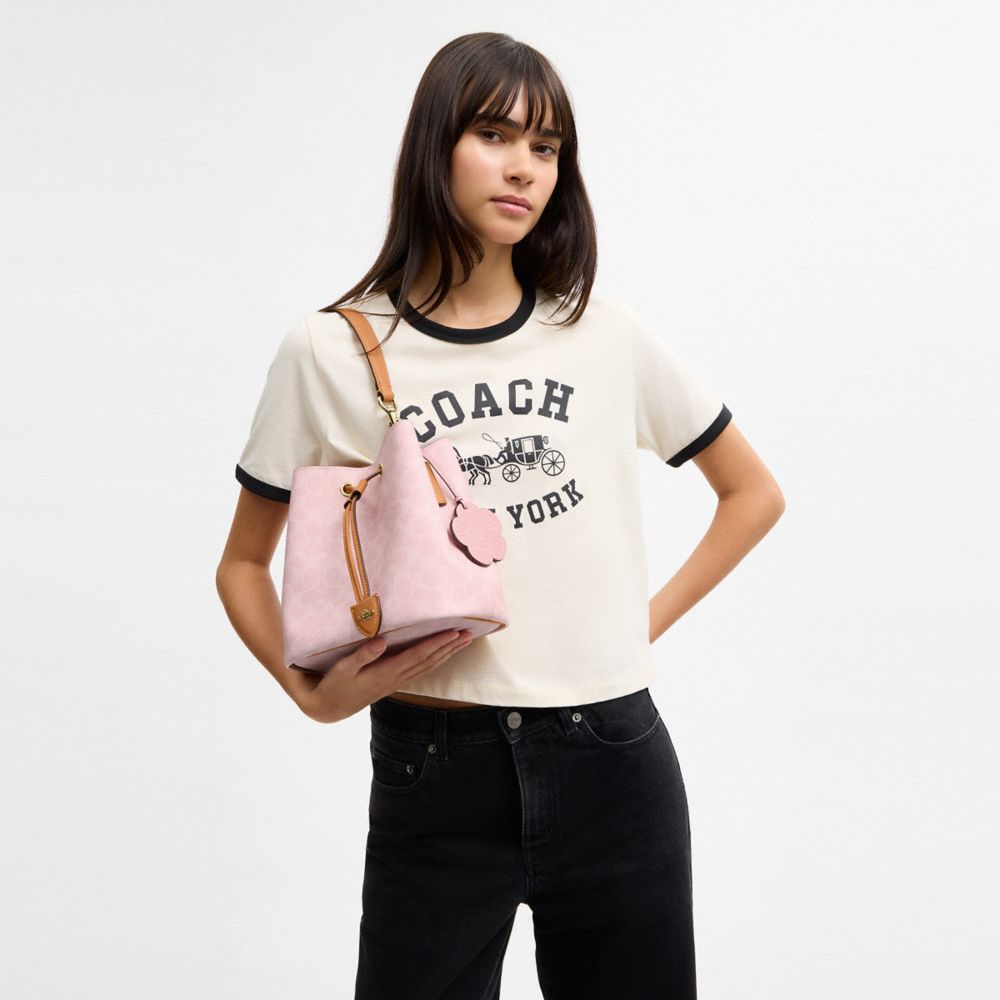 COACH®,SAC SEAU ROWAN EN TOILE EXCLUSIVE AVEC BRELOQUES,Toile exclusive,Or/Rose poudre,Detail View