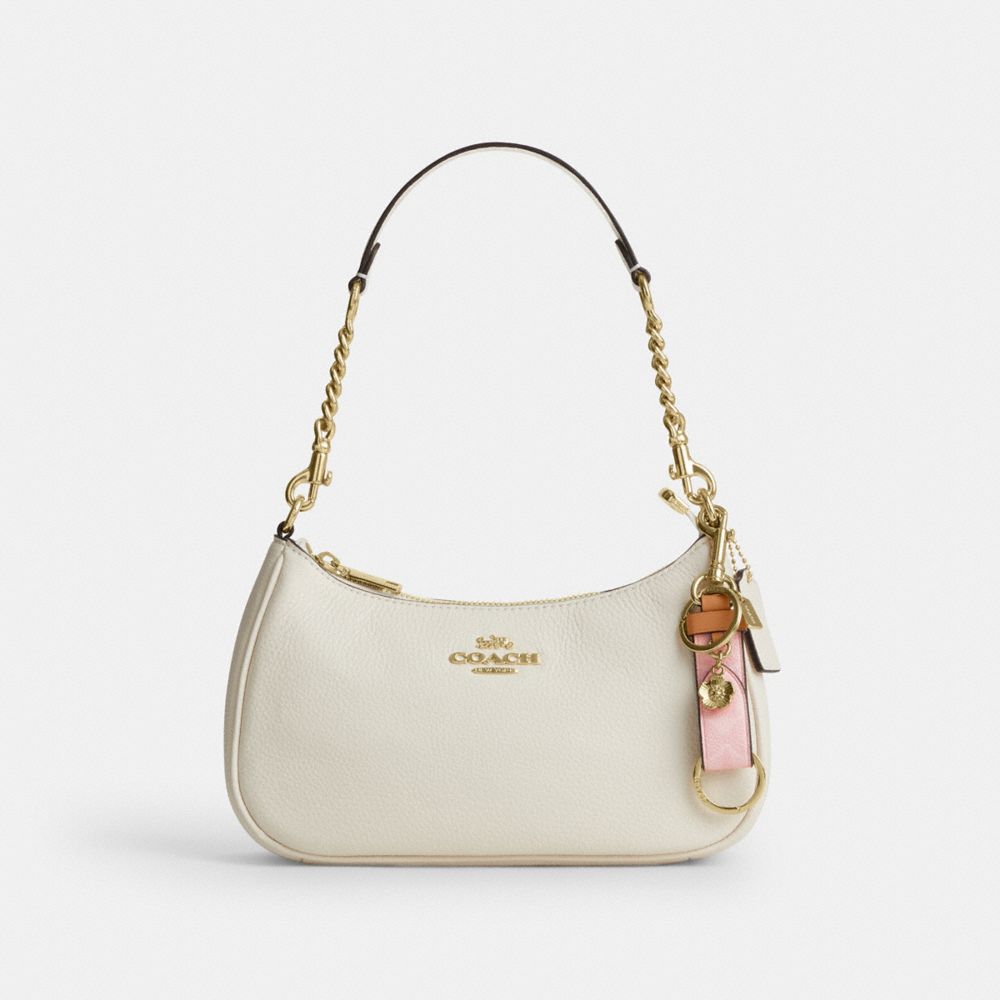 COACH®,Trigger Snap Bag Charm In Signature Canvas With Heart Charm,,Angle View