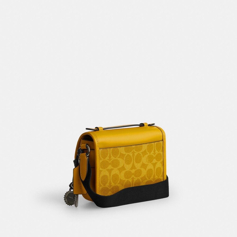 COACH®,Racer Crossbody Bag In Signature Canvas With Charms,,Angle View