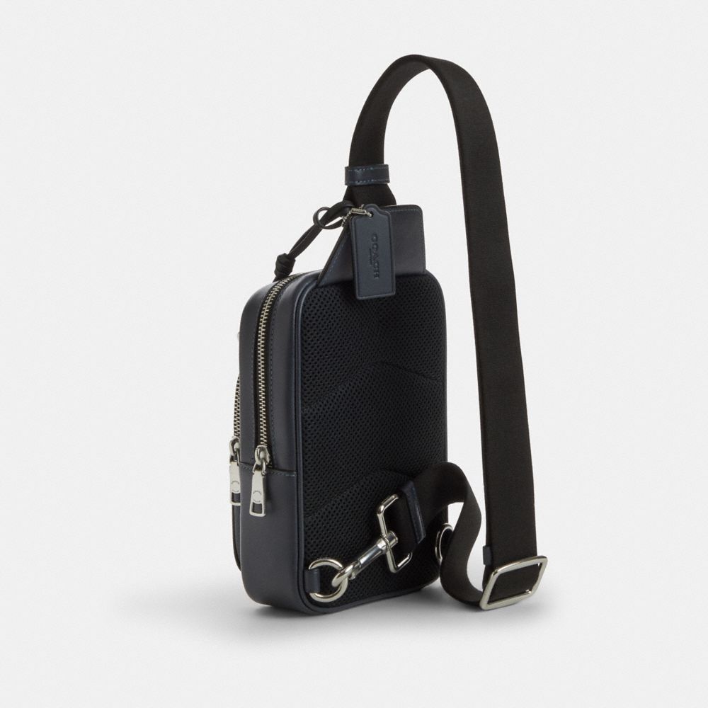 COACH®,Racer Sling Pack In Signature Canvas With Charms,,Angle View