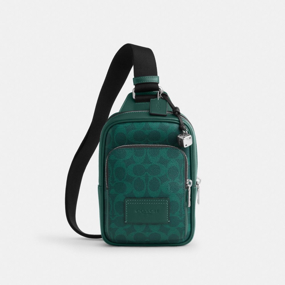 COACH®,Racer Sling Pack In Signature Canvas With Charms,,Front View