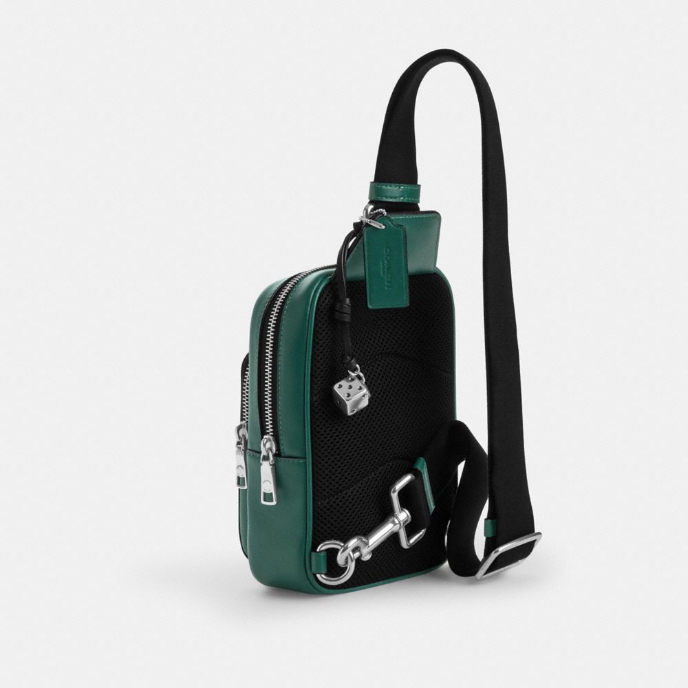 COACH®,Racer Sling Pack In Signature Canvas With Charms,,Angle View