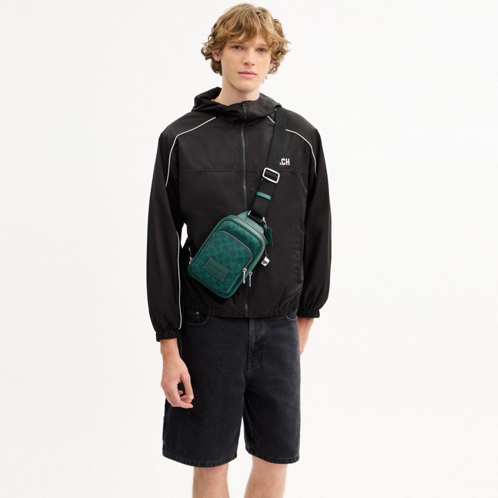 COACH®,Racer Sling Pack In Signature Canvas With Charms,,Detail View