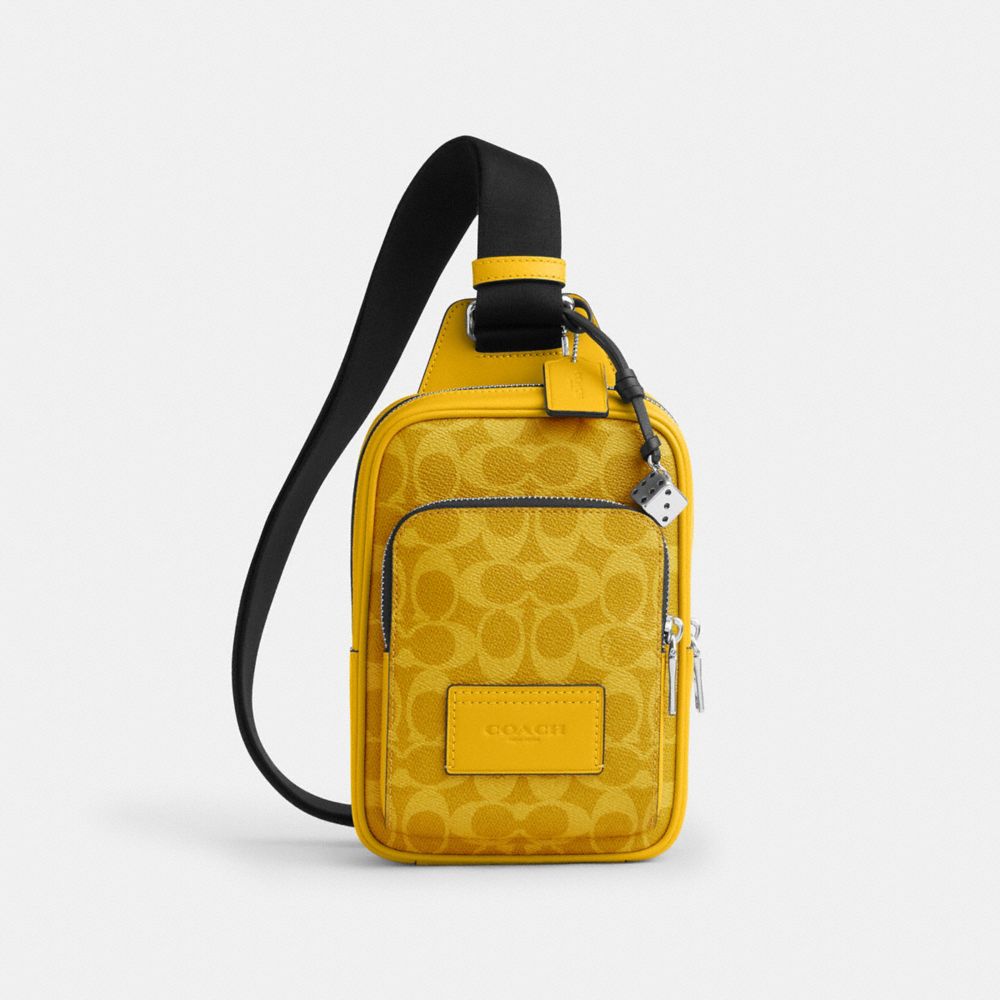 COACH®,Racer Sling Pack In Signature Canvas With Charms,,Front View