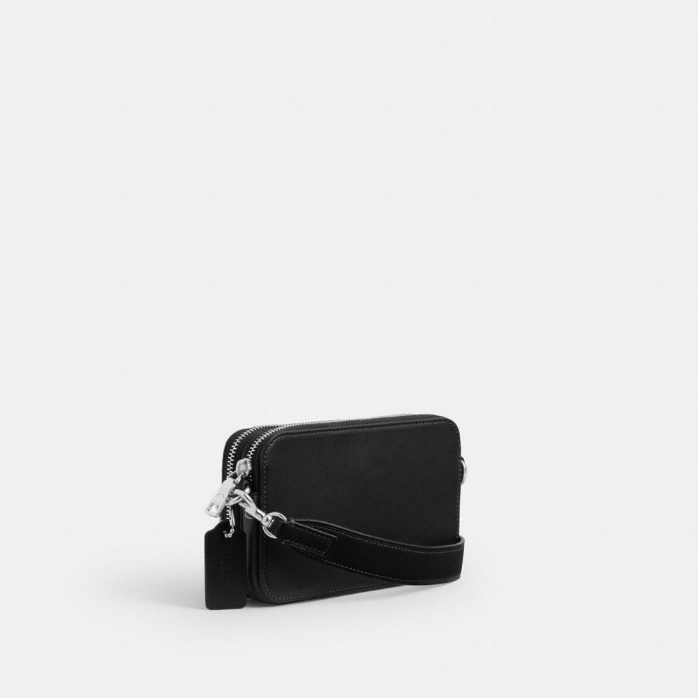 COACH®,Clinton Crossbody Bag With Floppy Graphic,Leather,Crossbody,Pendant,Compact,Sustainable,Adjustable,Silver Metal,Casual,Black,Angle View