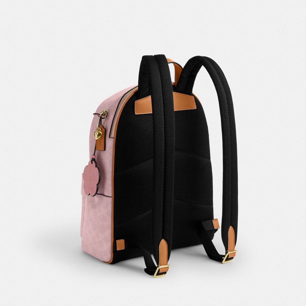 COACH®,Taylor Small Backpack In Signature Canvas With Charms,,Angle View
