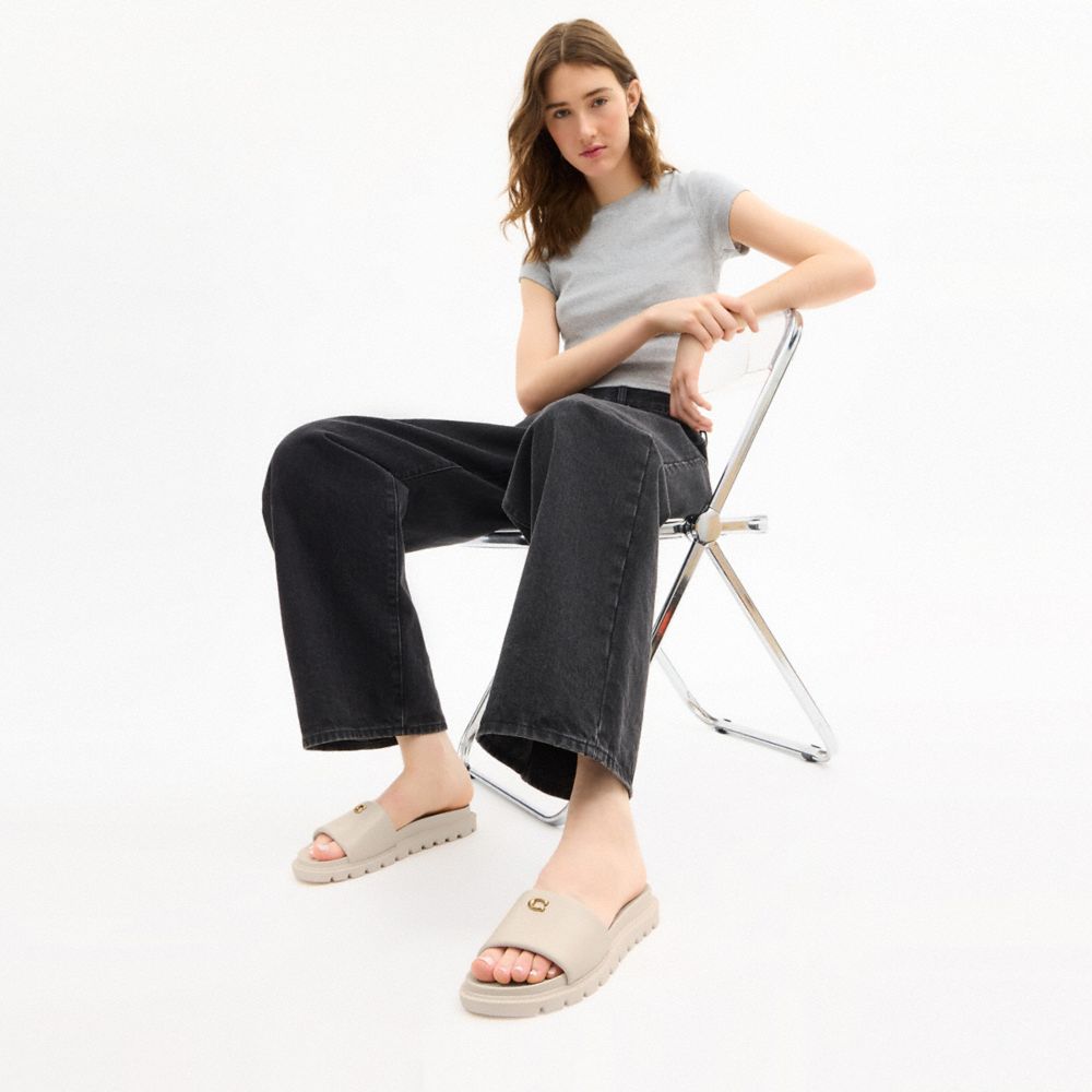 COACH®,Brynn Slide Sandal,Rubber,Slides,Logo,Metal,Flexible,Cushioned,Casual,Cream,Detail View