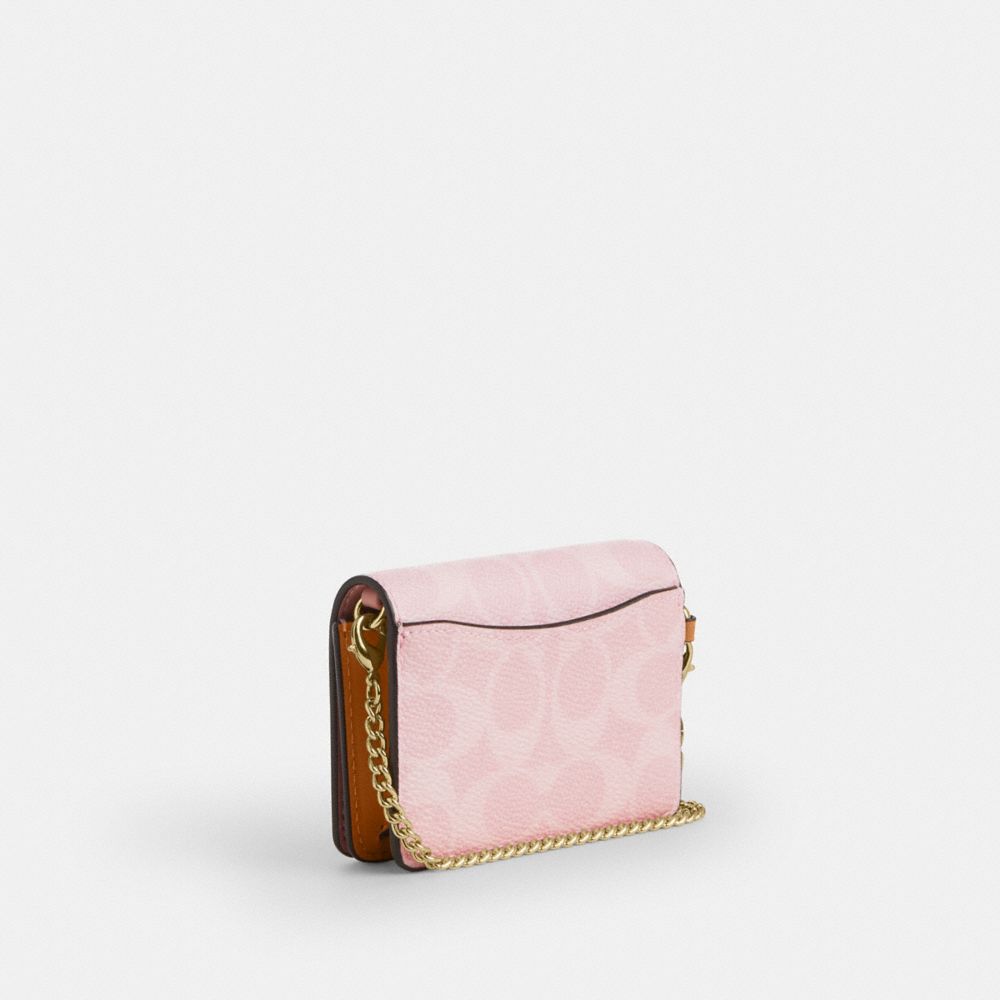 COACH®,Mini Wallet On A Chain In Signature Canvas With Charms,Pink,Angle View