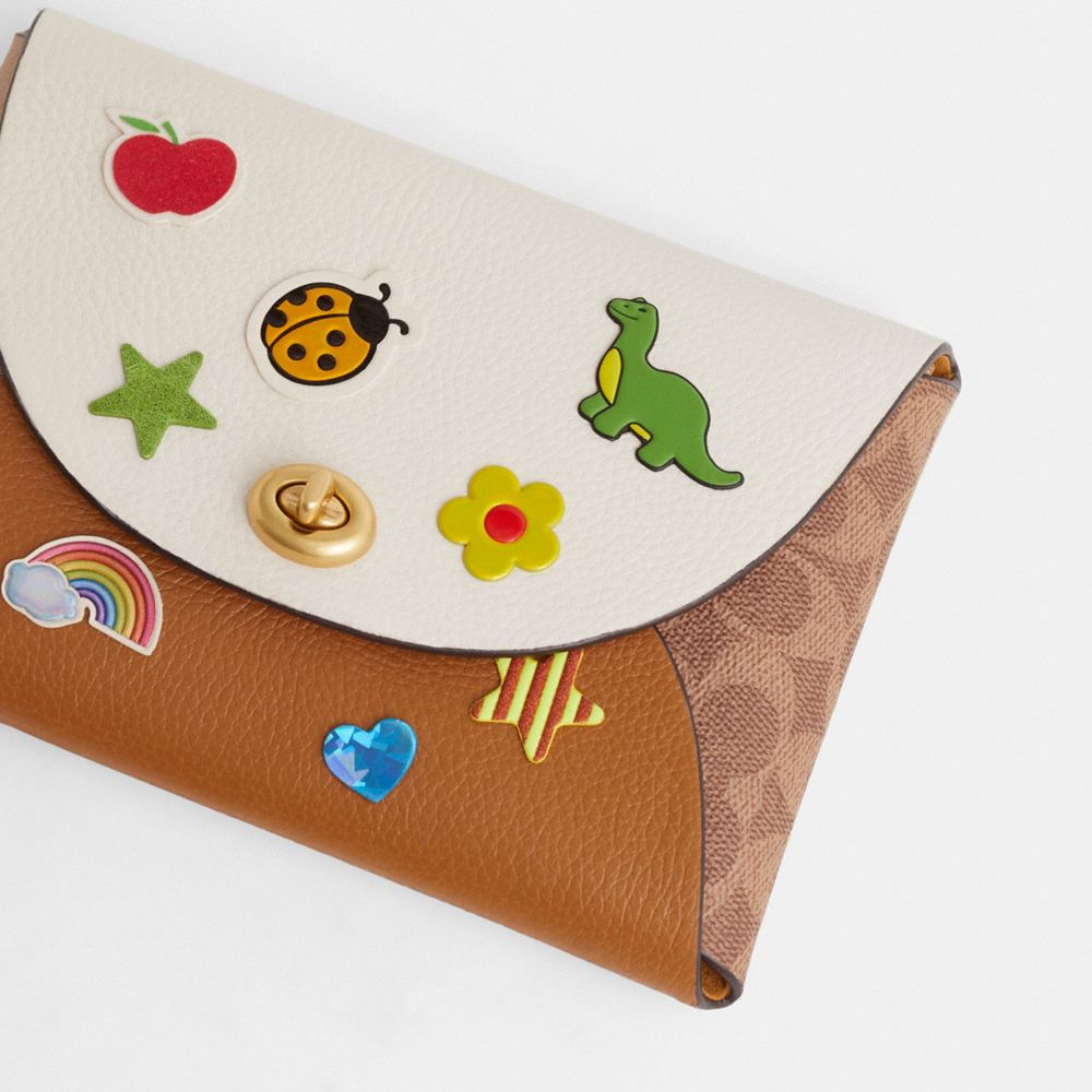 COACH®,Remade Large Colorblock Pouch With Stickers,,Closer View