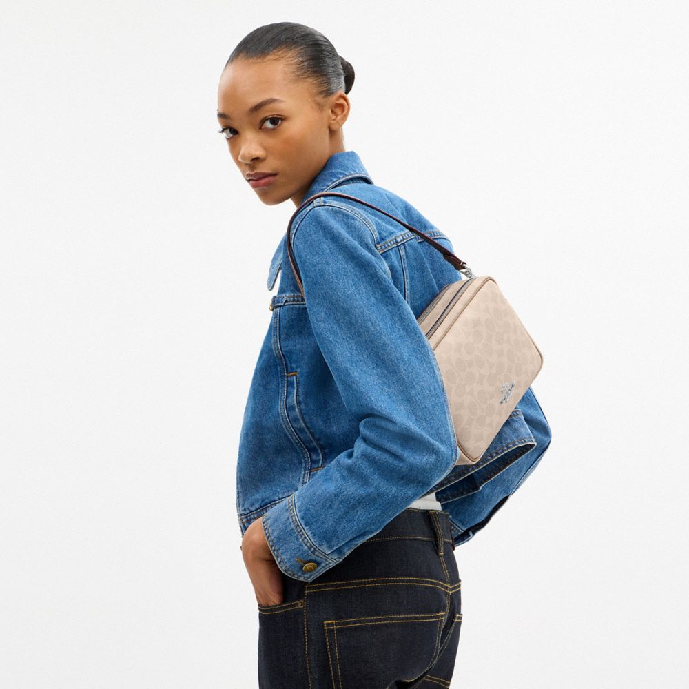 COACH®,Carey Crossbody Bag In Signature Canvas,Leather,Canvas,Recycled Polyester,Camera Bag,Metal,Logo,Sustainable,Gold Pl...,Multi Color,Detail View