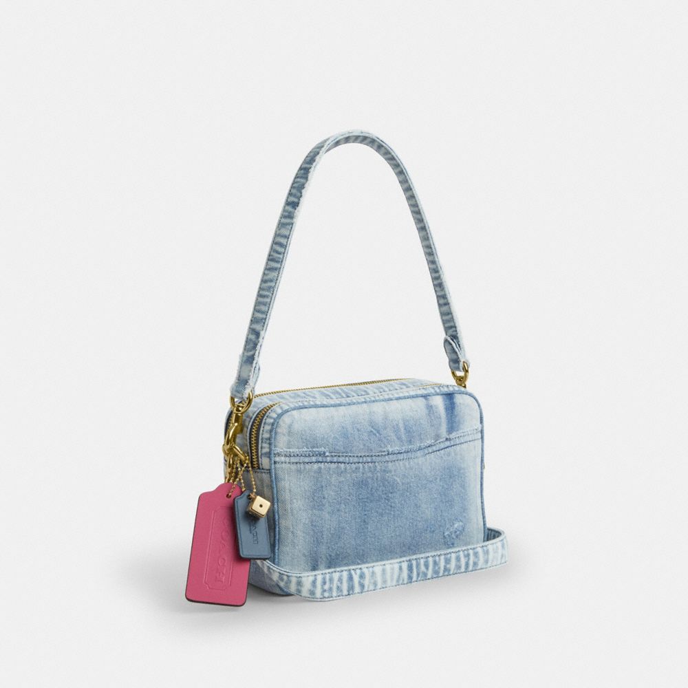 COACH®,Carey Crossbody Bag In Loved Denim With Charms,Denim,Cotton,Leather,Recycled Polyester,Camera Bag,3D Embellishment,...,Blue,Angle View