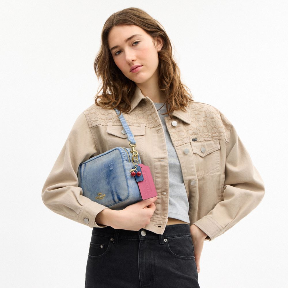 COACH®,Carey Crossbody Bag In Loved Denim With Charms,Denim,Cotton,Leather,Recycled Polyester,Camera Bag,3D Embellishment,...,Blue,Detail View