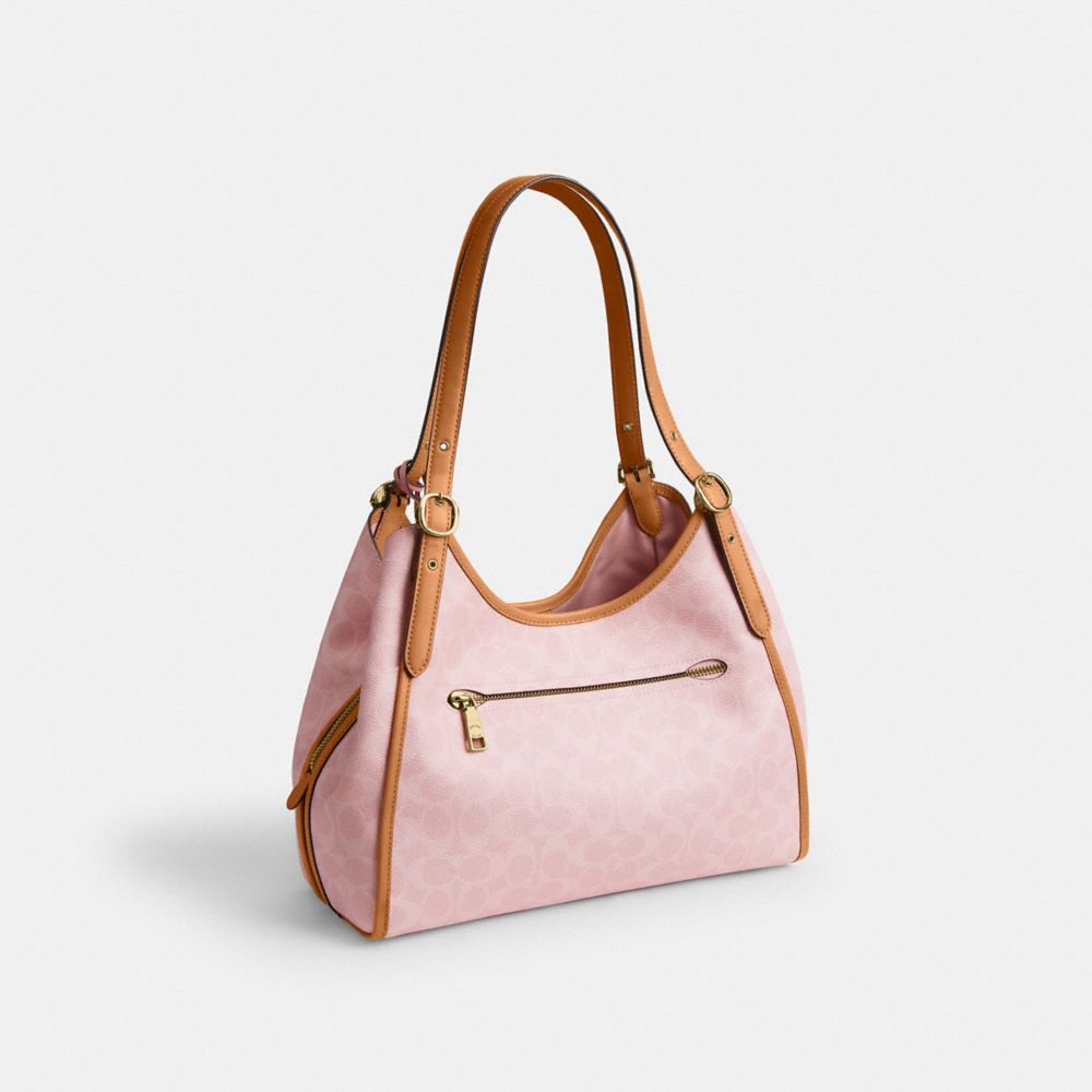 COACH®,Erin Shoulder Bag In Signature Canvas With Charms,Recycled Polyester,Leather,Canvas,Hobo,Metal,Logo,Piping,Casual,Pink,Angle View